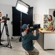 Production team filming on kitchen set