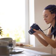 Woman taking a stock photo of a kitchenware